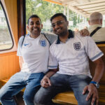 COLOGNE, GERMANY - JUNE 24: England fans take a boat over the Rhine River as they head to a fan zone on June 24, 2024 in Cologne, Germany ahead of the UEFA Euro 2024 Football Championship match between England and Slovenia tomorrow.  (Photo by Jack Taylor - The FA/The FA via Getty Images)